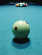 Close-up Of Cue Ball On Pool Table