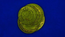 Spanish Gold Coins On Blue Background.