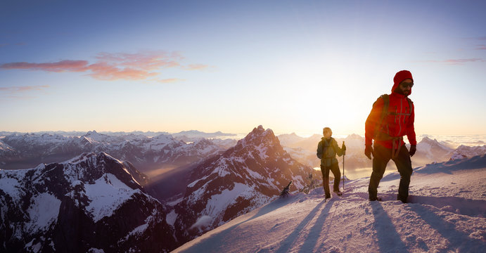 fantasy adventure composite image of man and woman mountaineering up snow with mountain peaks in bac