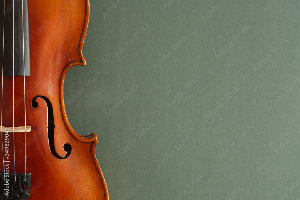 Classical music concert poster with brown color violin on dark green background with copy space for your text
 - obrazy, fototapety, plakaty 