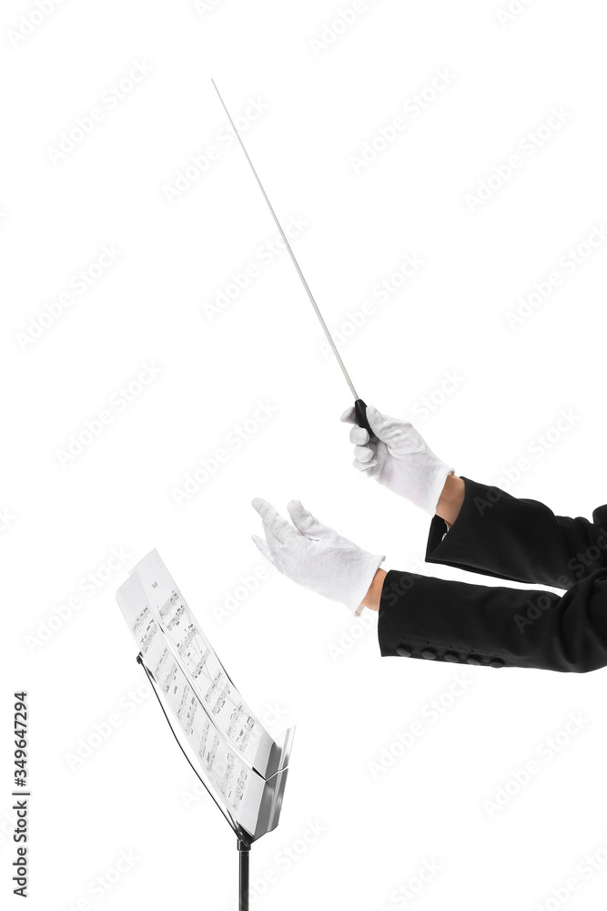 Hands of young female conductor on white background