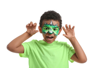 Funny African-American boy with face painting on white background