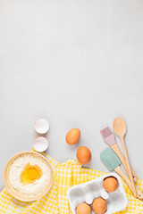 Wall Mural - Baking utensils and cooking ingredients for tarts, dough and pastry. Flat lay with eggs, flour. Top view, mockup for recipe, culinary classes, cooking blog. Flat lay
