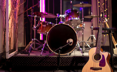 Acoustic guitar on the background of a recording Studio. Room for musicians rehearsals. The concept of musical creativity.