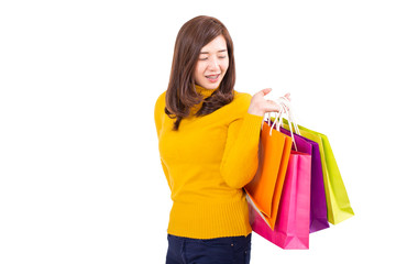 Beautiful asian girl carrying shopping bags. Shopping woman smiling. Beautiful Asian girl.