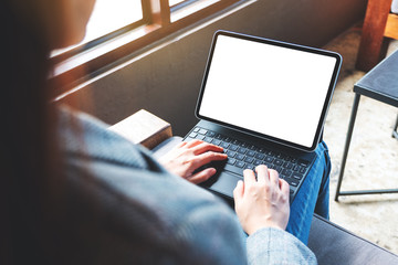 Mockup image of a woman using and typing on tablet keyboard with blank white desktop screen as computer pc