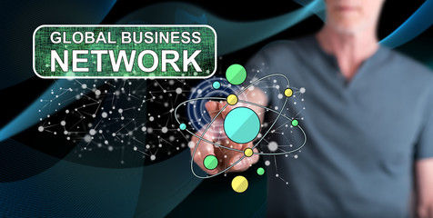 Wall Mural - Man touching a global business network concept