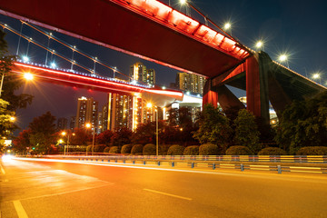 Poster - Red suspension bridges and highways at night