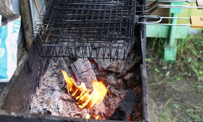 Coals in the grill. Barbecue at the dacha