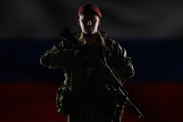 Wall Mural - Male in russian mechanized infantry uniform isolated with clipping path. Flag of Russian Federation on background.