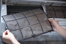 Woman Hand Holding Dirty Home Air Conditioner Filter For Remove For Cleaning Air Conditioner