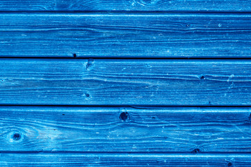 wooden boards background. aged weathered gray wooden planks. toned classic blue color trend 2020 year