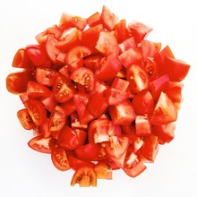 Close-up Of Chopped Tomatoes On White Background