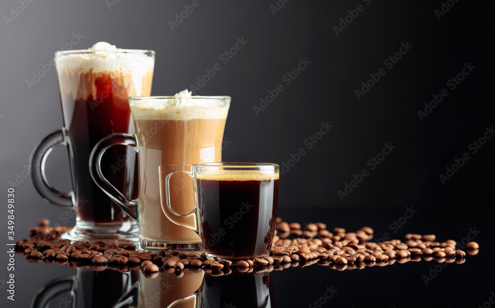 Espresso, latte macchiato and Irish coffee on black reflective background with coffee beans. - obrazy, fototapety, plakaty 