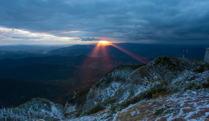 Wall Mural - Sunset rays in the mountain landscape. Ceahlau, Romania