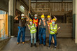 © visoot - Group of industrial or engineer corporate workers wear protective mask to Protect Against Covid-19 and hard hat helmet standing ready to work in front of the factory.
