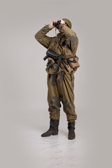 Wall Mural - Actor man in an old military uniform and camouflage clothing of a soldier of the Soviet army during the World War II