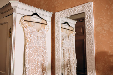 Wall Mural - white bride's dress. Detail of the dress close-up. The dress on a hanger.