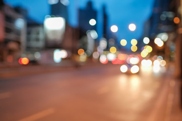 Blurred defocused lights of heavy traffic and abstract blur image of night light bokeh on street - Copy space of transportation and travel concept