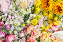Floral Background. Lot Of  Decoration Artificial Flowers In Colorful Composition