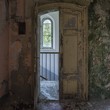 old wooden door in abandoned house