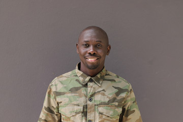 Soldier Portrait Face, Black African Man wearing camouflage uniform