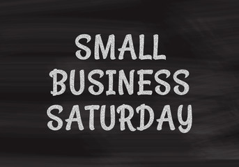 Small Business Saturday written in white chalk on a black chalkboard