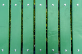Fototapeta Sypialnia - green wooden Park bench background