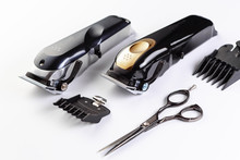 Clipper Trimmer And Scissors On A White Background