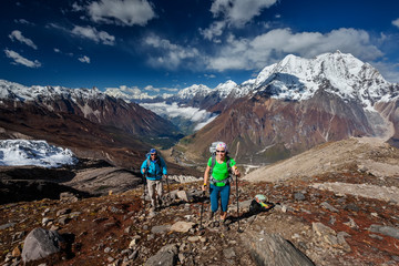 Wall Mural - hiker enjoys the view in the himalayan mountains