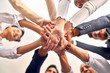 © Krakenimages.com - Group of business workers standing with hands together at the office