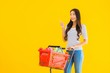 © siraphol - Portrait beautiful young asian woman shopping grocery from supermarket and cart