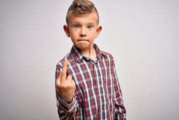 Young little caucasian kid with blue eyes wearing elegant shirt standing over isolated background Showing middle finger, impolite and rude fuck off expression