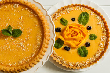 Delicious traditional homemade pie shortcrust pastry close-up on the wooden table.