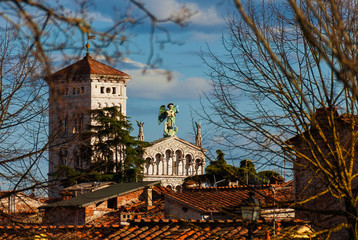 Wall Mural - View of Lucca historic center with medieval St Micheal in Forum Church, a city landmark, rises above the city old roofs