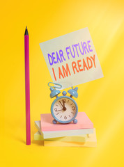 Wall Mural - Conceptual hand writing showing Dear Future I Am Ready. Concept meaning state action situation being fully prepared Alarm clock sticky note notepads pencil colored background