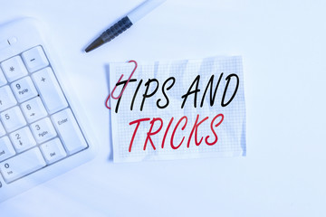 Wall Mural - Word writing text Tips And Tricks. Business photo showcasing means piece advice maybe suggestion how improve White pc keyboard with empty note paper above white background