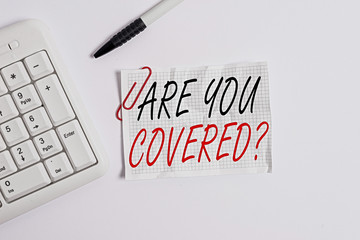 Word writing text Are You Covered Question. Business photo showcasing asking showing if they had insurance in work or life White pc keyboard with empty note paper above white background