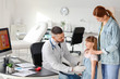 © Pixel-Shot - Woman with her little daughter visiting gastroenterologist in clinic