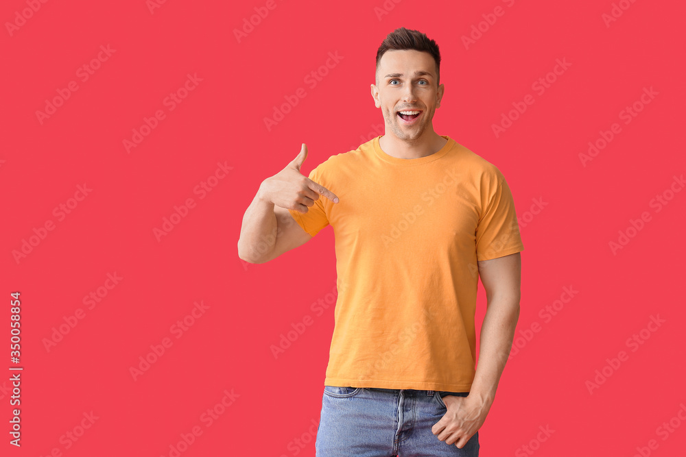 Man in stylish t-shirt on color background