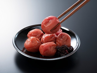 Japanese pickled plums on a black background