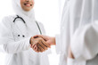 © Art_Photo - Success of handshake two muslim asian female doctor in hospital.healthcare and medicine