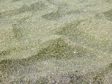 Close Up Of The Grains Of Sand On The Green Sand Beach (Papakolea) On The Big Island Of Hawaii