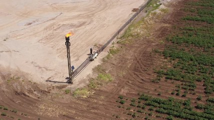 Wall Mural - Gas torch and a cotton field, Brazos County, Texas, USA