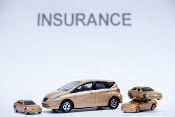 Car placed on insurance documents. Car insurance concept