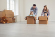 © Studio Romantic - Happy family have fun playing in a new house in the room.