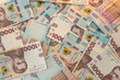 © RomanR - Top view background with  new banknote of Ukraine 1000, UAH.