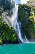 Waterfall in Milford Sound's fiord land in the south island of New Zealand.