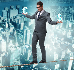 Businessman balancing between choosing dollar and euro