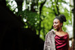 © AS Photo Family - Portrait of a beautiful natural young African woman with afro hair. Black model in red silk dress.
